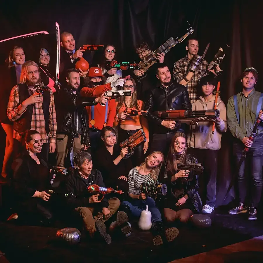 Blasters crew and friends with their props